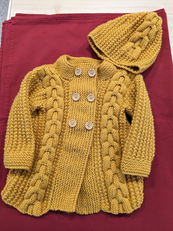 Child's cable jacket with matching hat