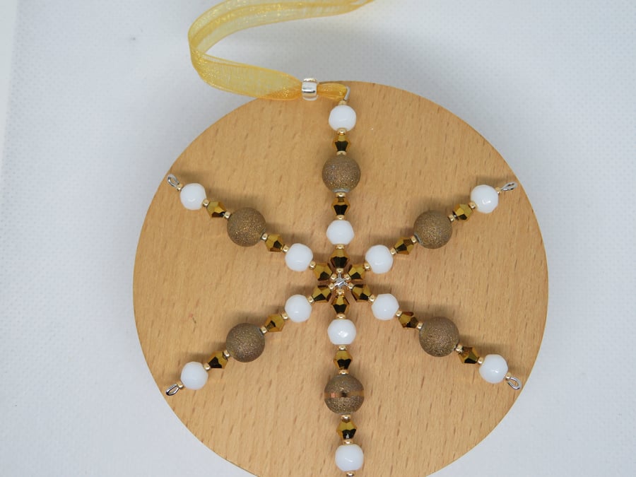 Gold and white snowflake decoration