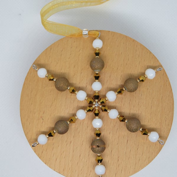 Gold and white snowflake decoration