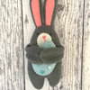 Easter Bunny hugging an egg decoration 