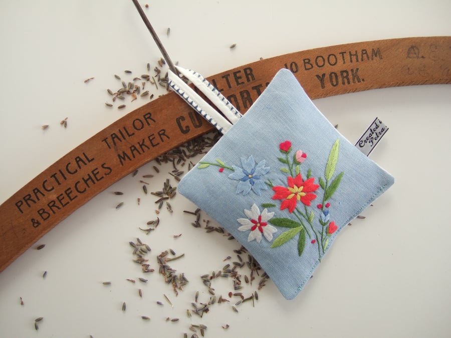 Blue linen lavender bag with vintage embroidery and dried Yorkshire lavender.