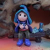 Tiny seated Gnome 'Conn' with wired legs on bench seat OOAK by Ann Galvin