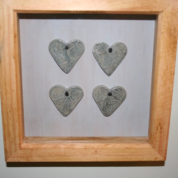 Wooden frame with hand made ceramic small blue textured valentine hearts