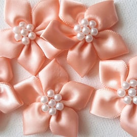 5 peach and pearl ribbon flower embellishments 40mm wide approx.