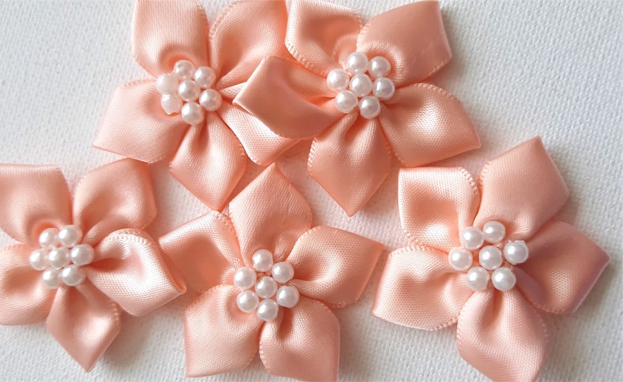 5 peach and pearl ribbon flower embellishments 40mm wide approx.