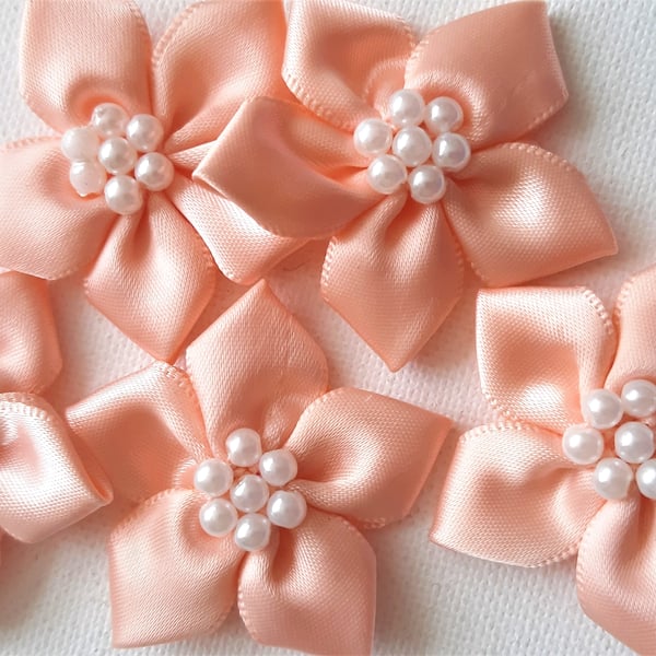 5 peach and pearl ribbon flower embellishments 40mm wide approx.