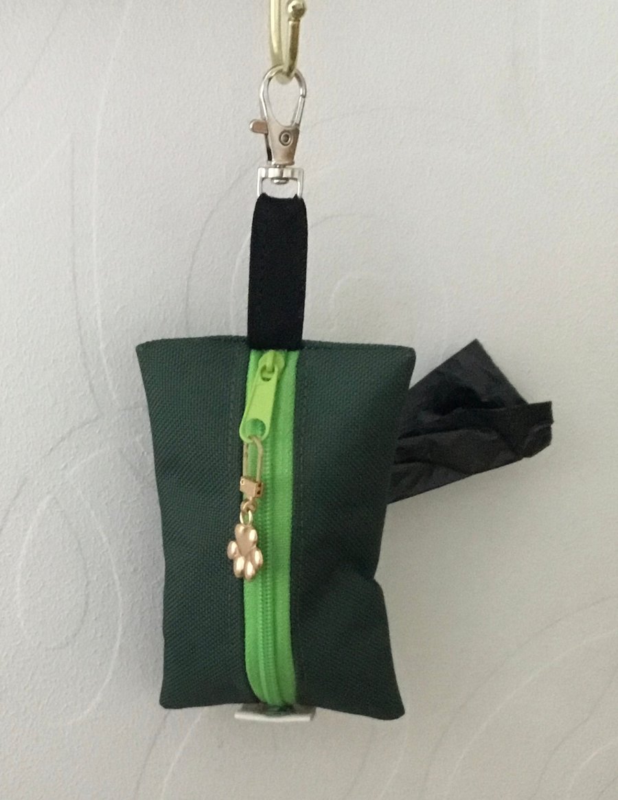 Green dog bag carrier.