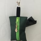 Green dog bag carrier.
