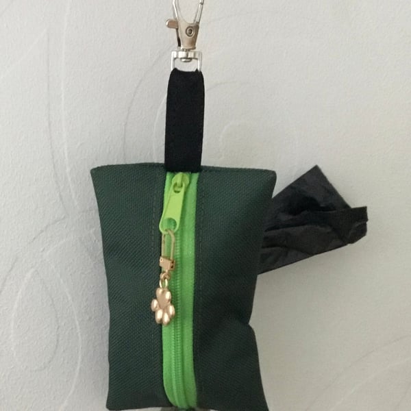 Green dog bag carrier.