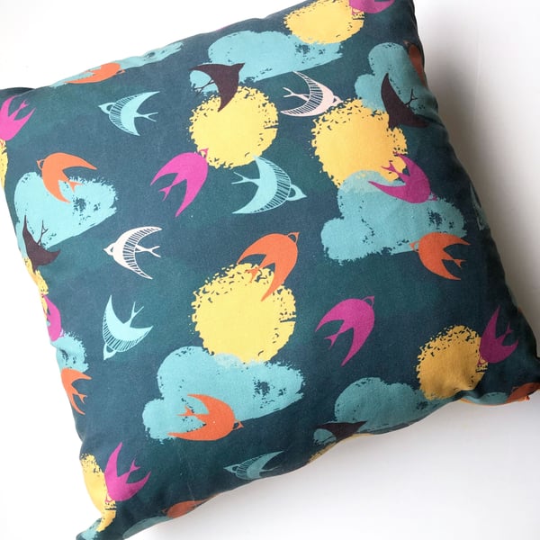 fly free cushion with bird print in bright colours