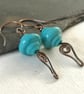 Copper earrings with teal lamp work bead and wire work - Image 6