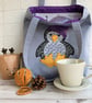 Penguin tote bag in pale blue with a paisley penguin in a purple bobble hat - Image 7