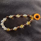 Elasticated "hope" bead bracelet with sunflower charm