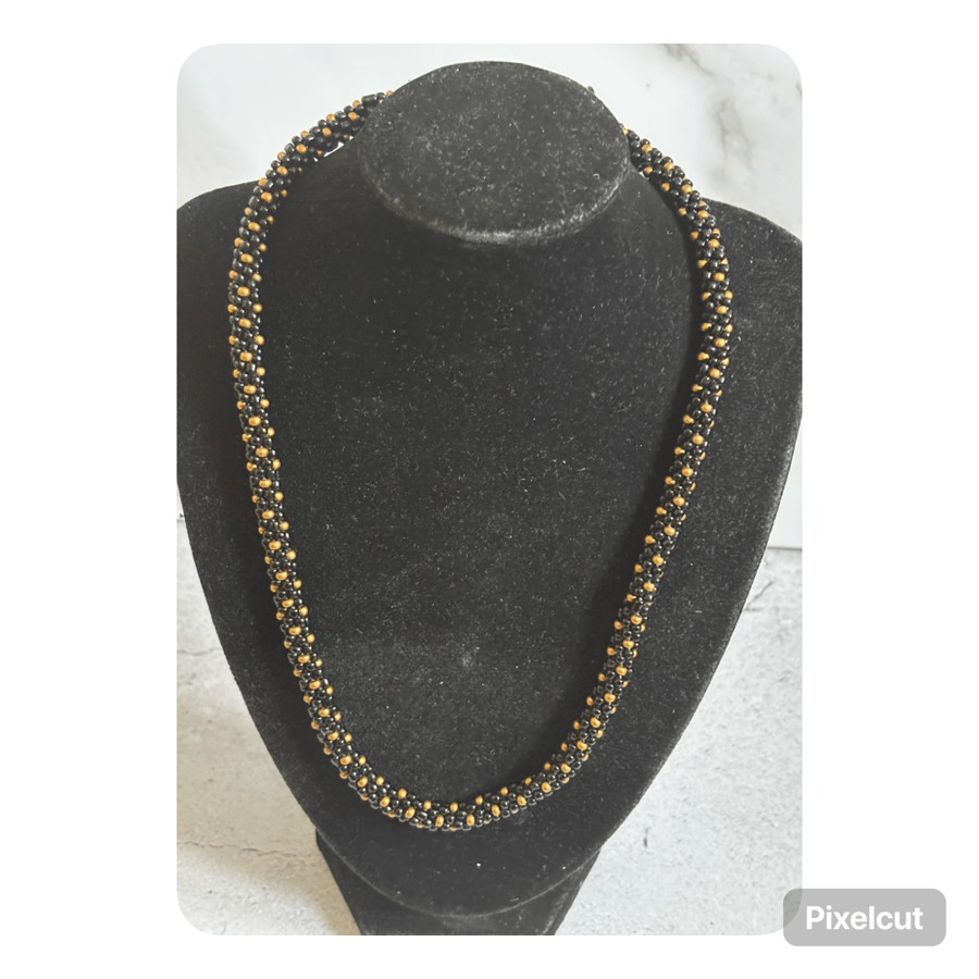 Black and bronze polka dot kumihimo beaded necklace