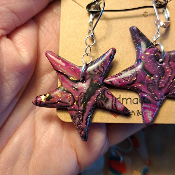 Funky pair of bright purple, black and gold leaf star earrings
