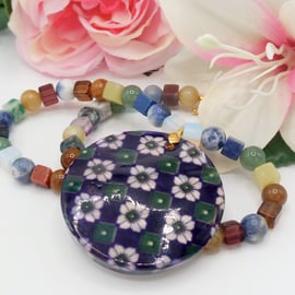 Purple Mother of Pearl Pendant with a Floral Pattern on Mixed Gemstone Necklace