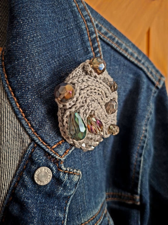 Crocheted and beaded brooch