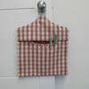 Peg bag in pink check with floral lining