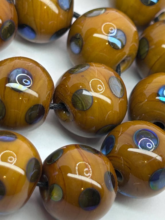 Handmade brown and iridescent sporty lamp work glass beads