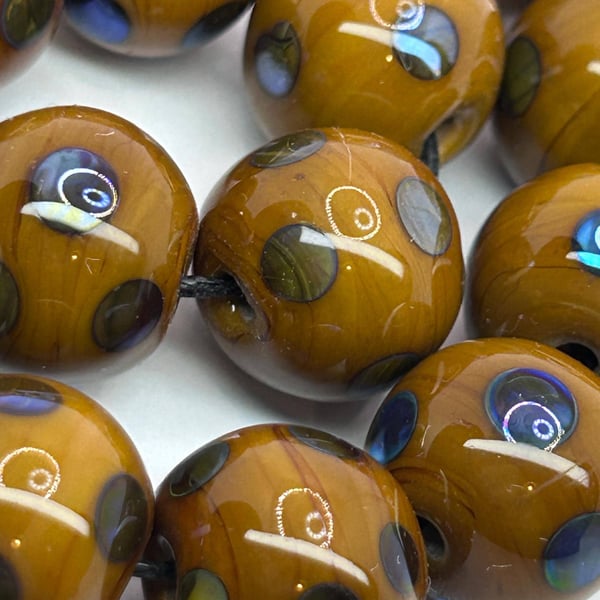 Handmade brown and iridescent sporty lamp work glass beads
