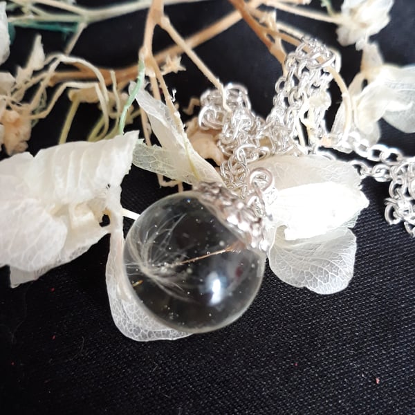 R10. Clear resin globe pendant with dandelion seed