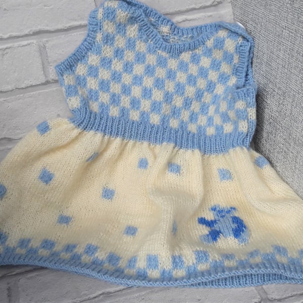 Knitted baby pinafore dress with teddy bear detail