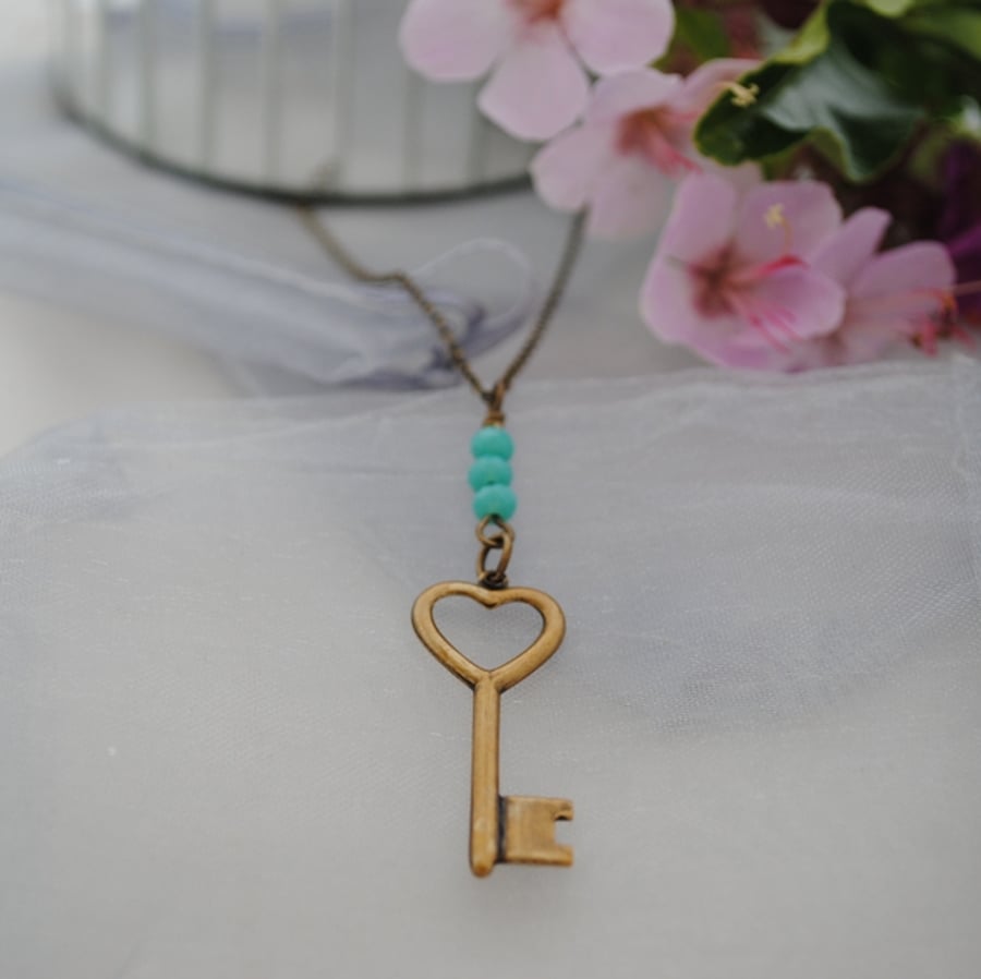 Brass key necklace with turquoise rondelles