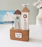 Tall Wooden Sea Huts with Clay Flower and Seagull 'By the Sea'