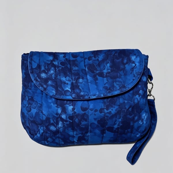 Small but spacious blue clutch bag with wristlet