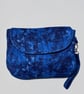 Small but spacious blue clutch bag with wristlet