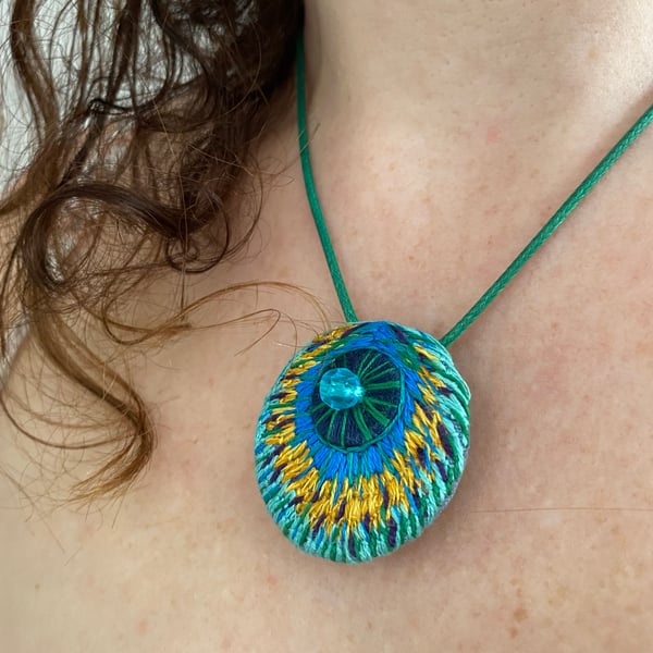 Hand embroidered pendant, inspired by peacock feathers 