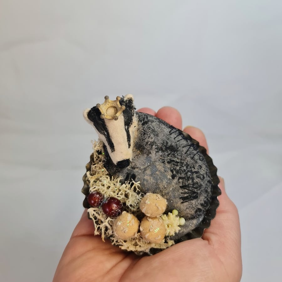 Soft sculpture sleeping badger textile art.