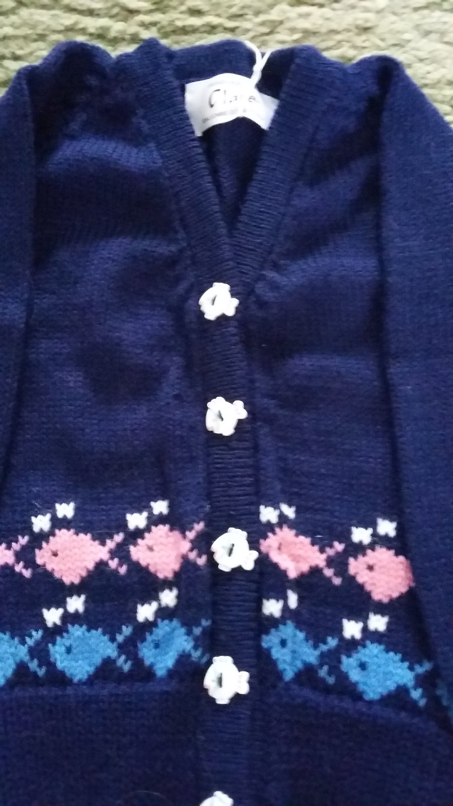 Cardigan or jumper with fish round the bottom