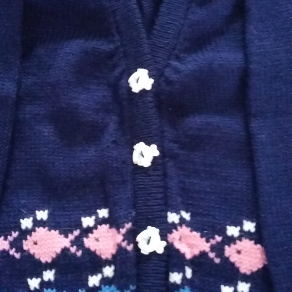 Cardigan or jumper with fish round the bottom