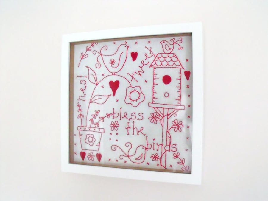 framed red work embroidered birds wall hanging