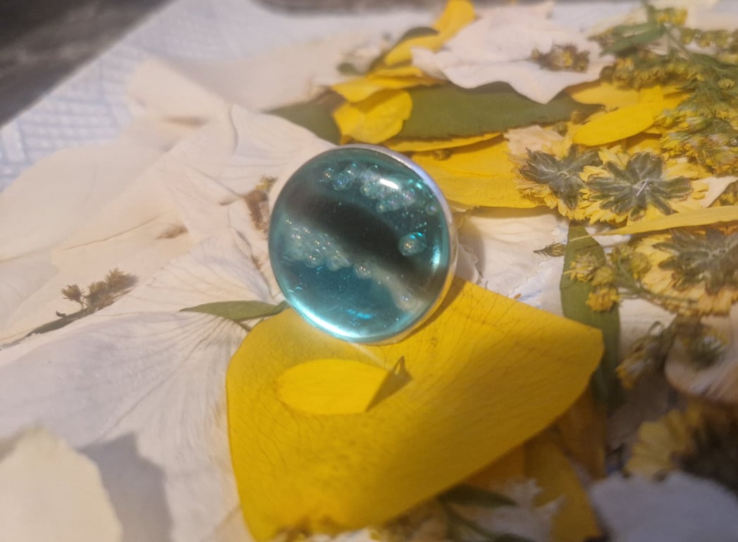 Adjustable blue resin ring... "on the horizon"