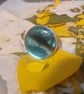 Adjustable blue resin ring... "on the horizon"