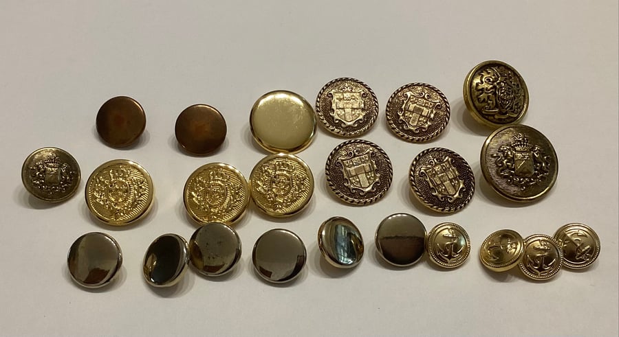 Buttons, twenty three brass coloured, metallic  plain, shield and anchor designs