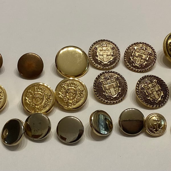 Buttons, twenty three brass coloured, metallic  plain, shield and anchor designs