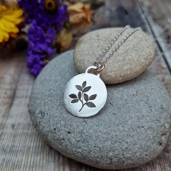 Sterling Silver Leaf Cut Out Disc Necklace.