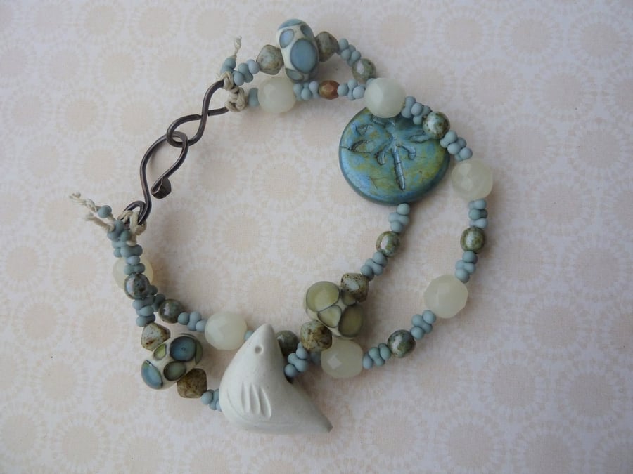 handmade lampwork cream bird bracelet