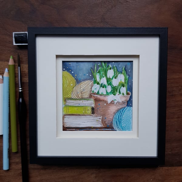 Snowdrops, books and yarn - small original artwork, framed 