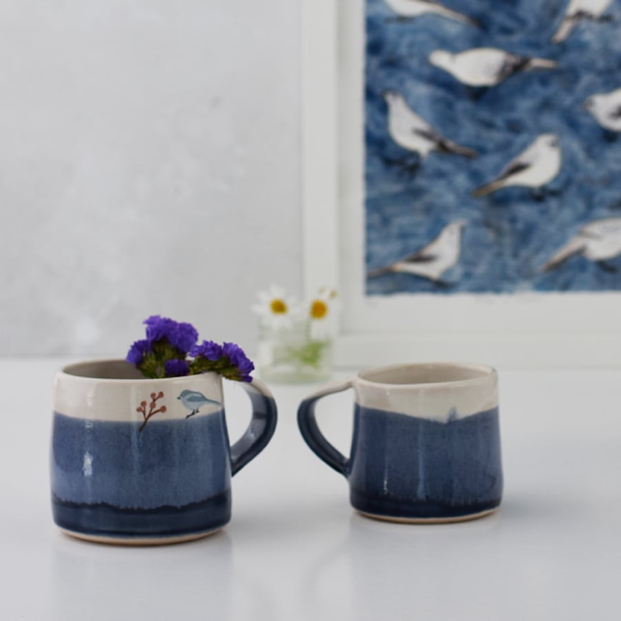 Blue and white ceramic mug with bird - handmade illustrated pottery