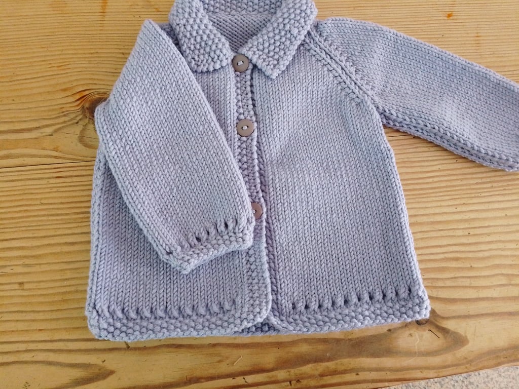 Baby cardigan handmade in lavender merino wool for 3-6 months.