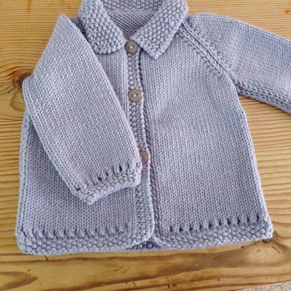 Baby cardigan handmade in lavender merino wool for 3-6 months.