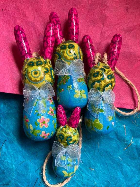 A family of 4 wooden colourful bunnies 