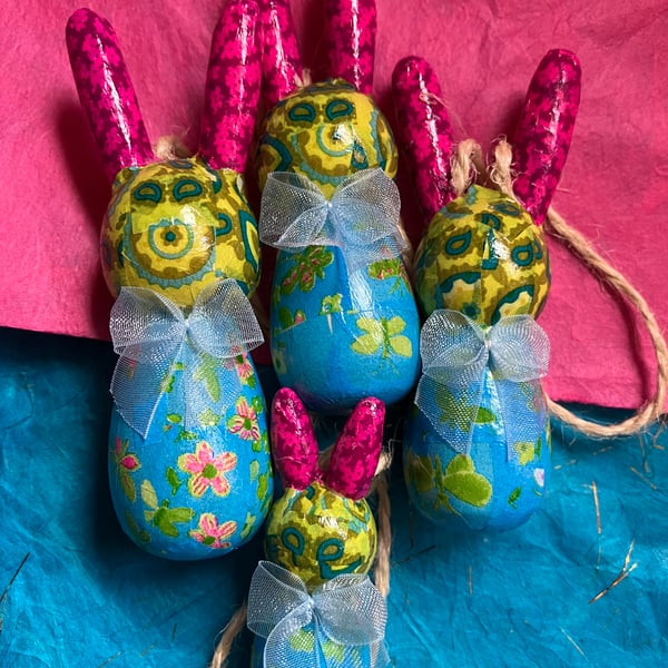 A family of 4 wooden colourful bunnies 