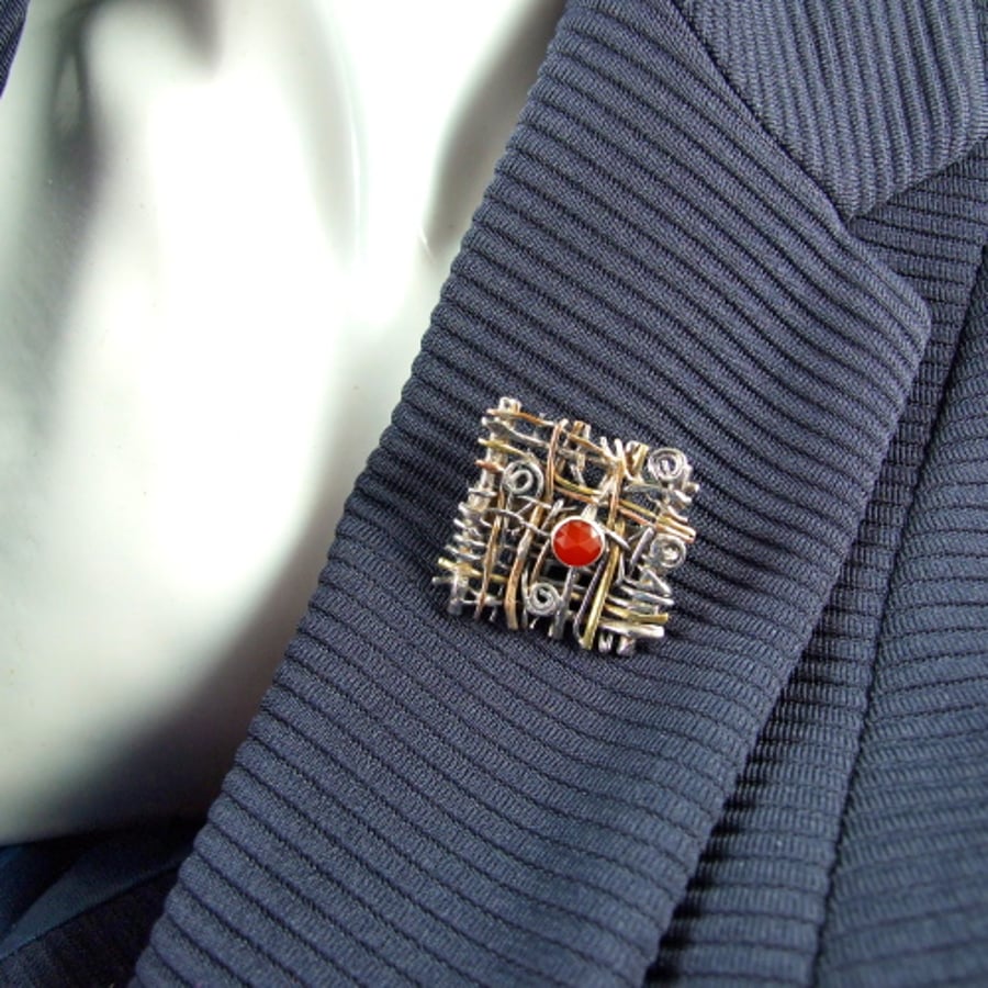 Woven Silver Brooch with Copper and Brass Accents and Carnelian Gemstone