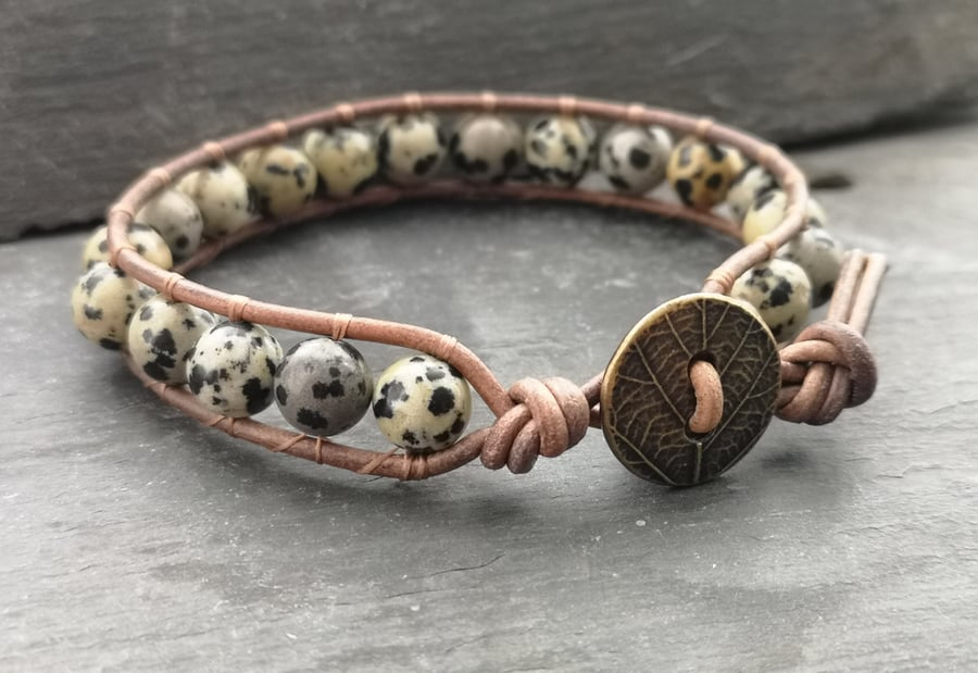 Leather bracelet with dalmatian jasper beads and leaf button fastener