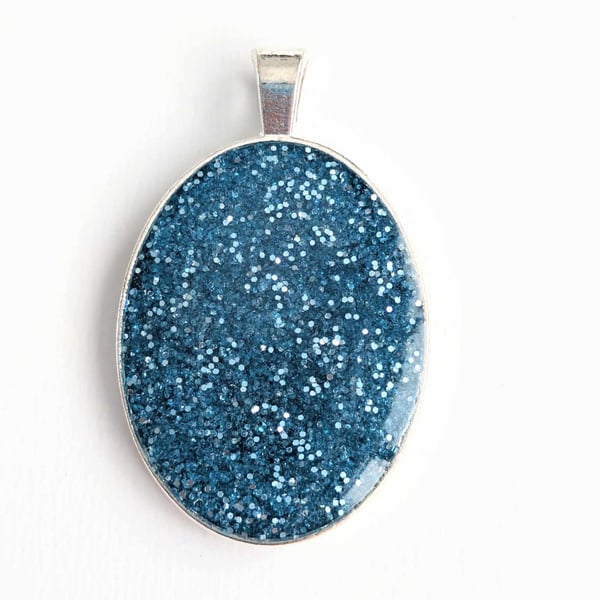 Oval Pendant With Blue Glitter
